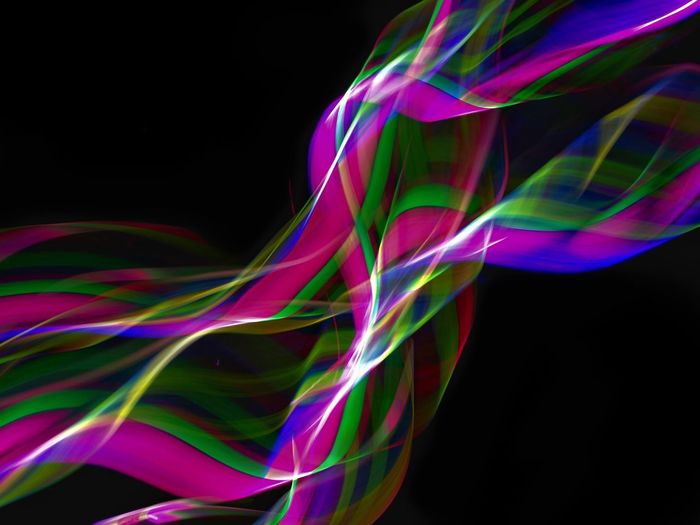 Close-up of multi colored light over black background