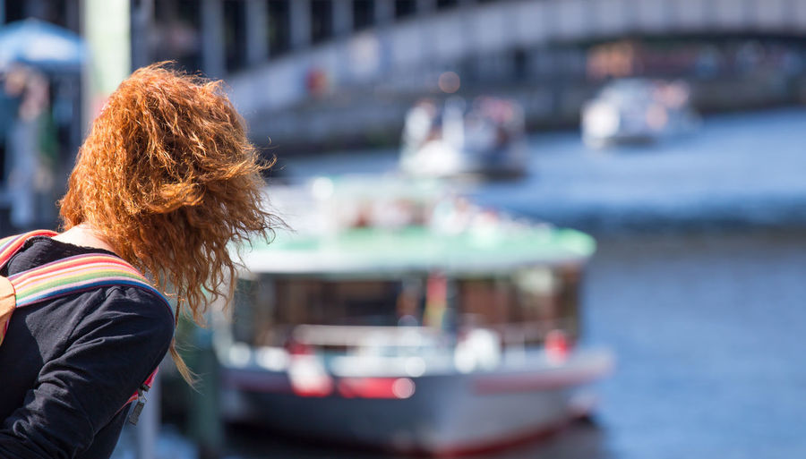 Woman with redhead looking at ship