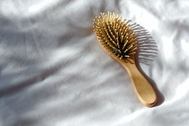 High angle view of comb on bed at home