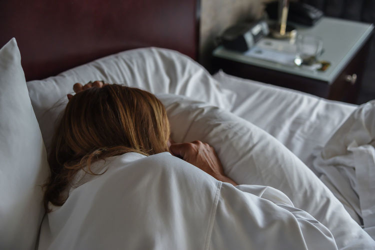 Woman sleeping on bed