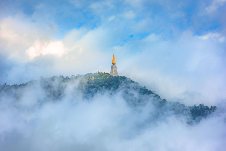 The top of the pagoda in the valley and the beauty of the fog  at phu tub berk in thailand