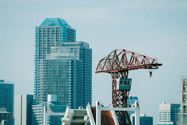 Modern buildings against sky in city