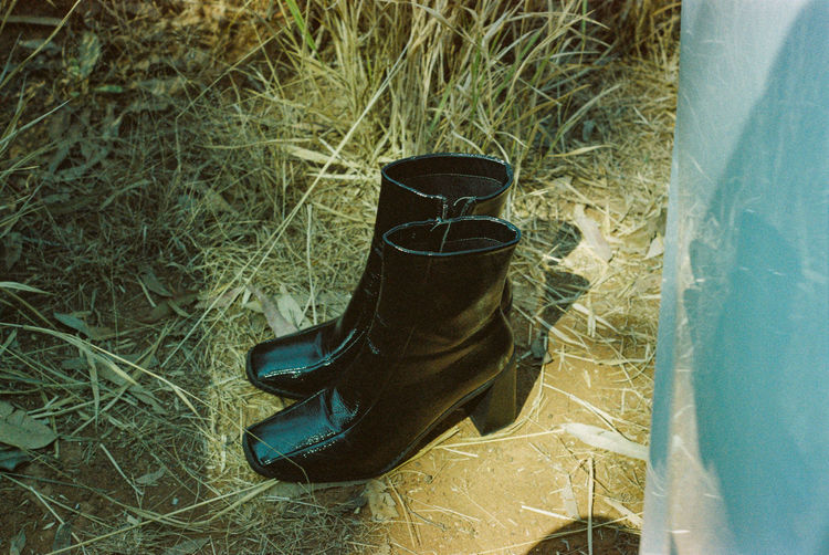 High angle view of shoes on grass