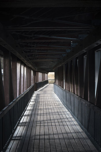 Diminishing perspective of empty footbridge