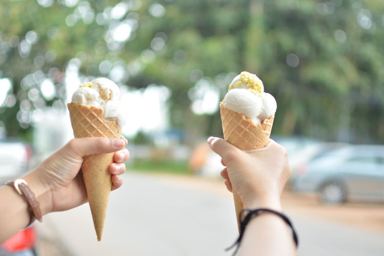 Close-up of hands holding ice cream