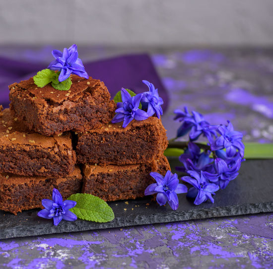 Close-up of sweet food with flowers on table
