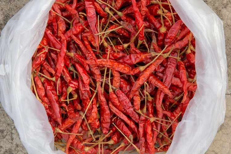 High angle view of red chili peppers in container