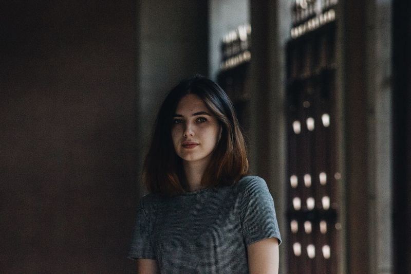 Portrait of young woman at home