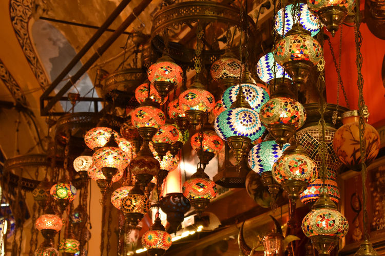 Low angle view of illuminated chandelier hanging at market stall