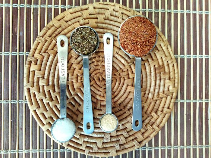 High angle view of spices in spoons