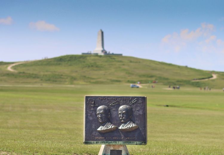 Close-up of memorial against countryside landscape