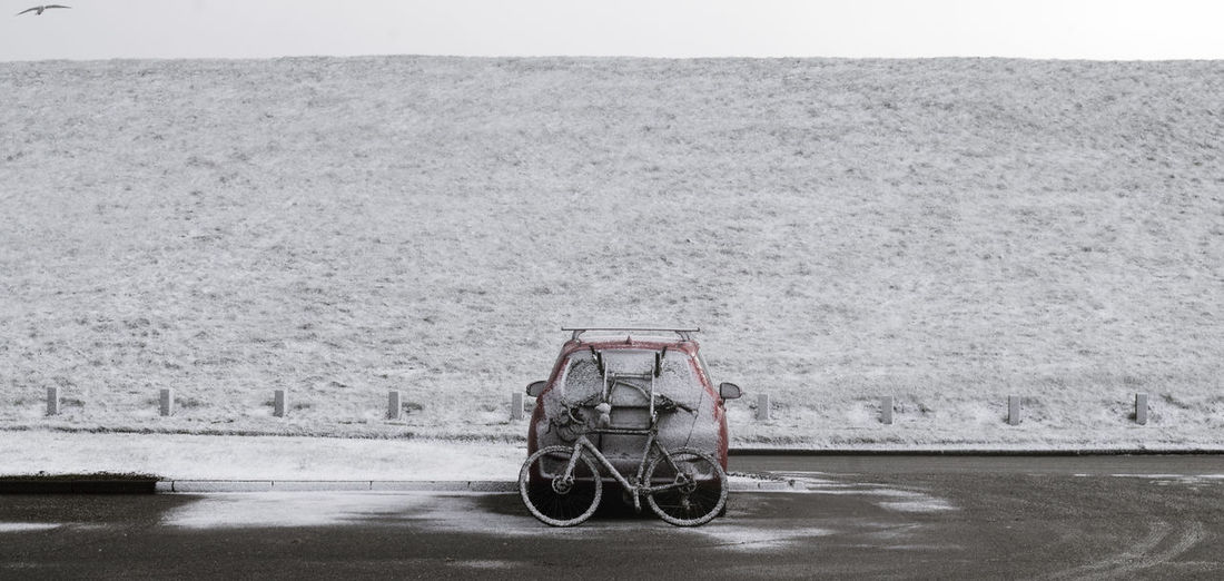 Bicycle on road against sky