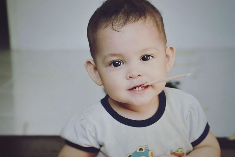 Portrait of cute baby girl at home