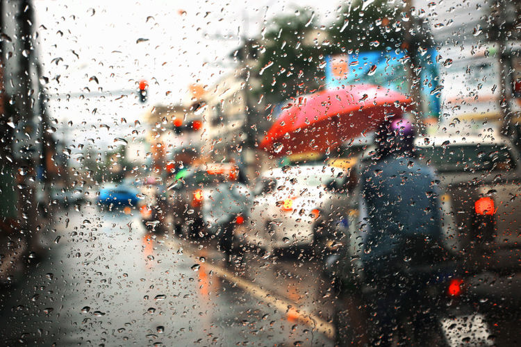 Full frame shot of wet car window during rainy season