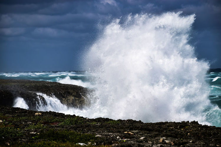 Water splashing against sky