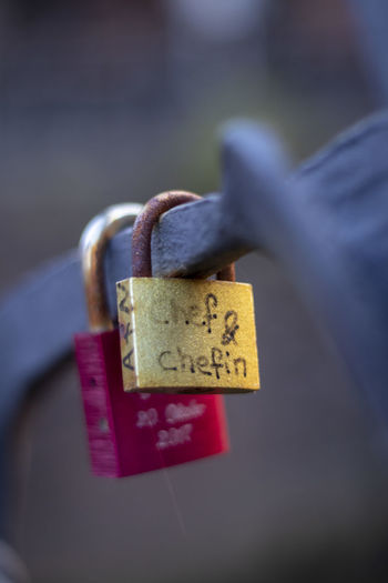 Close-up of love padlocks hanging on metal