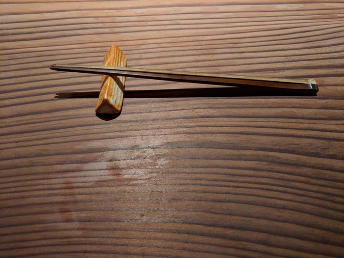 High angle view of umbrella on wooden table