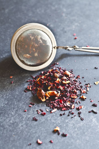 Tea infuser with dried flowers on table