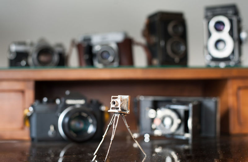 Miniature of old vintage camera on table