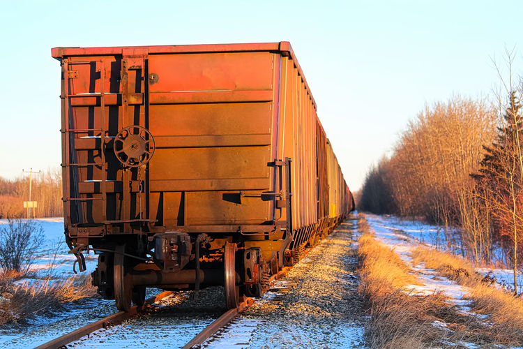 A grain train car waiting on a track.