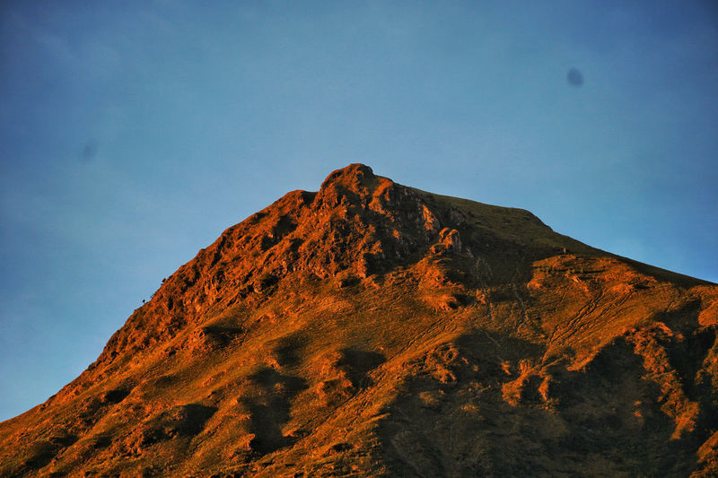 Low angle view of rock against sky