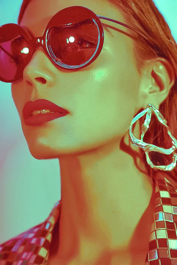 Close-up portrait of man wearing sunglasses at store