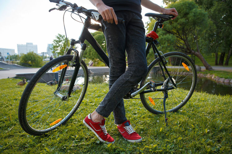 Low section of person riding bicycle