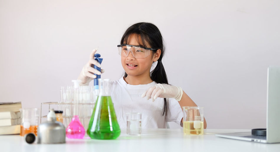 Girl experimenting at laboratory