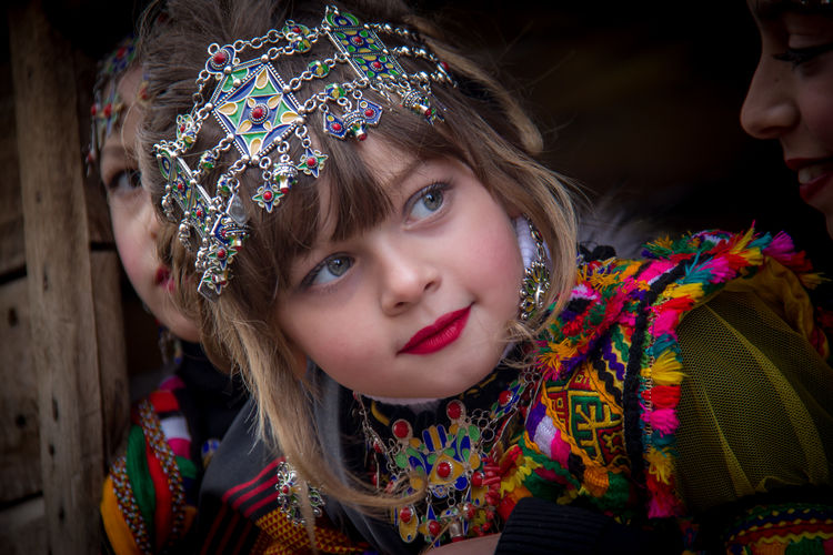 Close-up of cute girl wearing traditional clothing