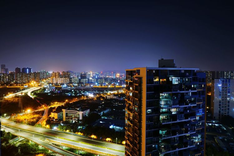 Illuminated  shenzhen cityscape against sky at night