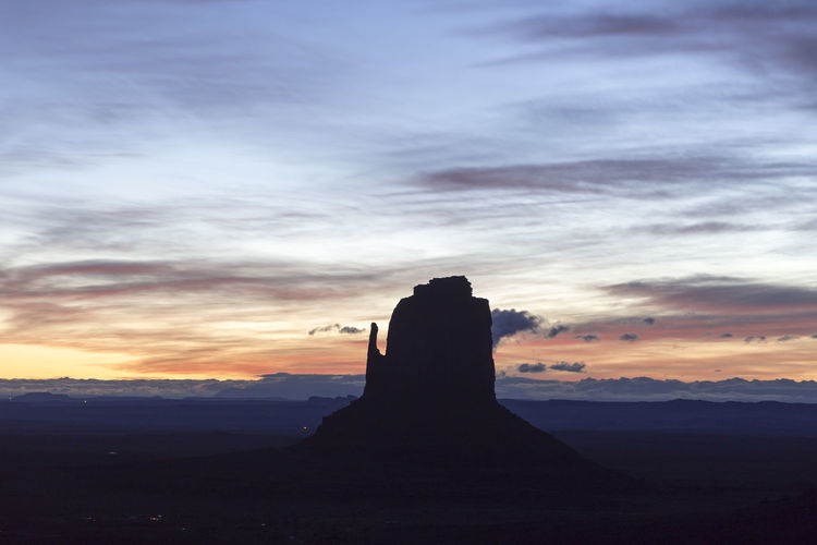 The east mitten butte in monument valley navajo tribal park at sunrise against a colourful sky 
