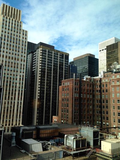 Buildings in city against sky
