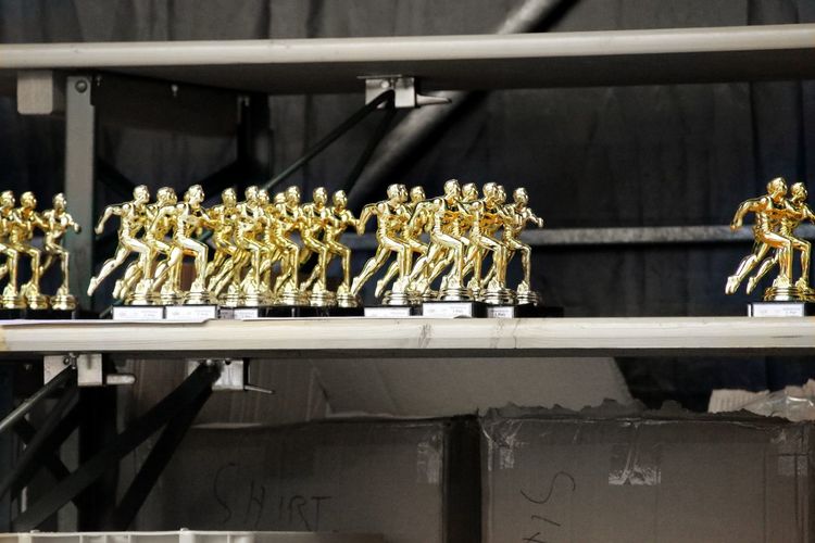 Close-up of awards on shelf in factory