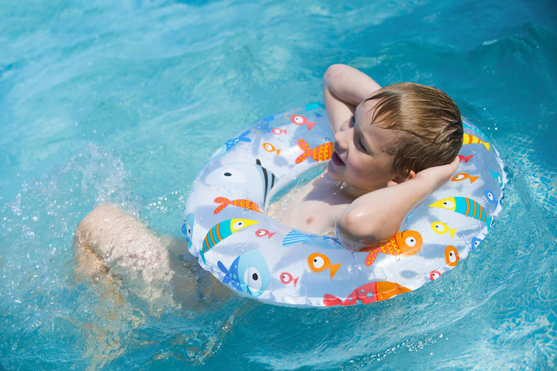 High angle view of boy swimming in pool