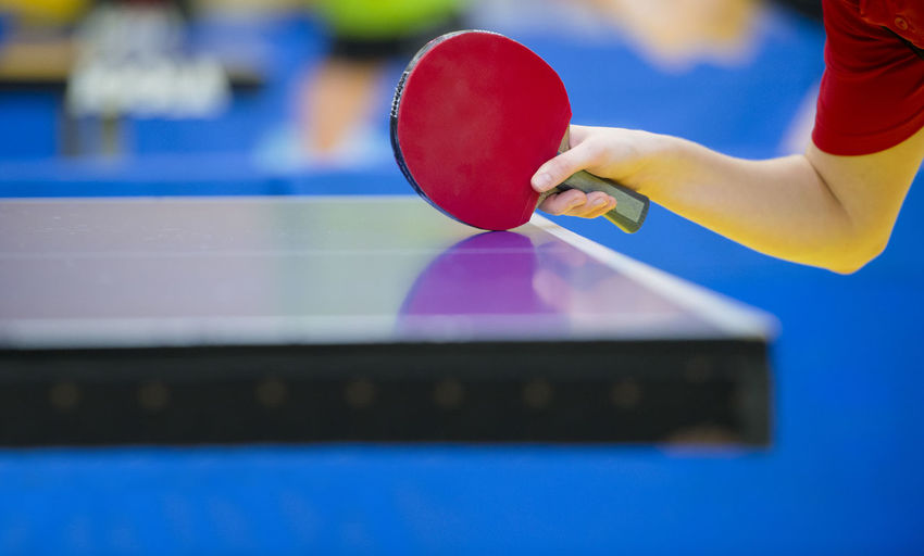 Man playing table tennis in court