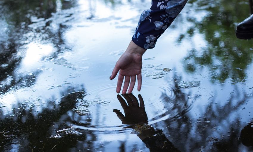 Low section of person in puddle