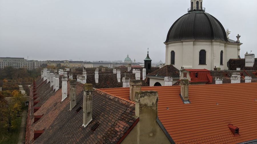 Buildings in city against sky
