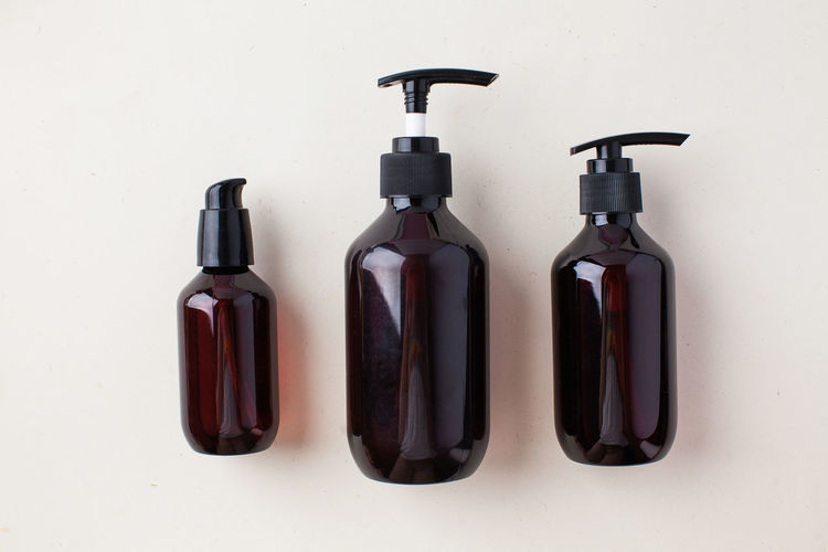 Three different brown bottles with natural organic cosmetics products. natural zero waste 