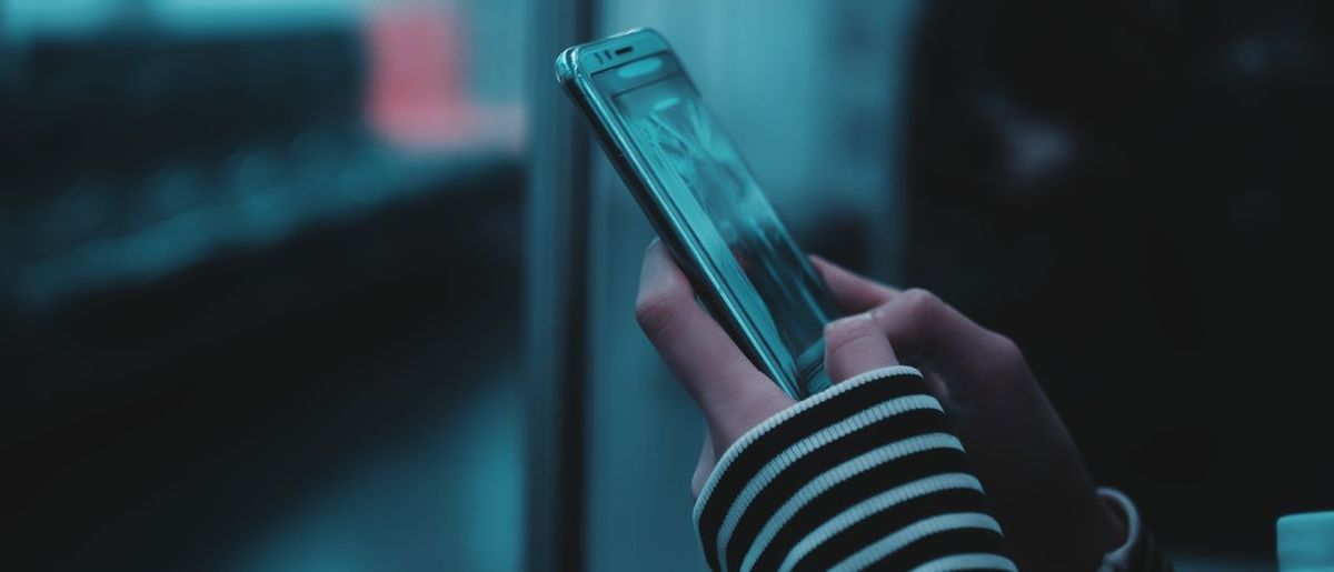 Close-up of person using smart phone