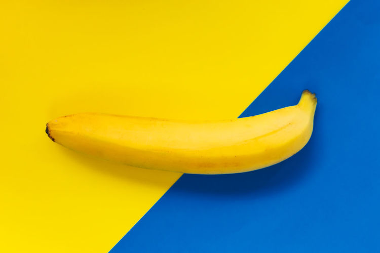 High angle view of bananas against yellow background