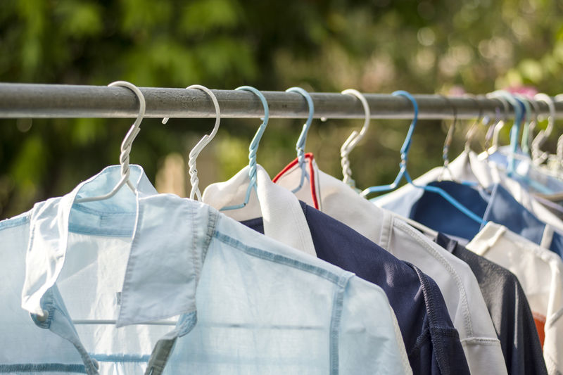 Close-up of clothes drying on rack