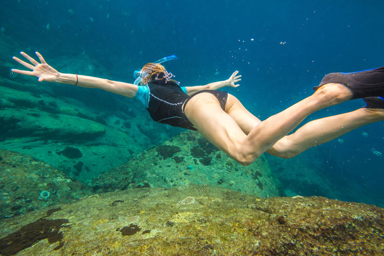 Full length of woman swimming in sea