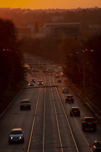 High angle view of traffic on road at sunset