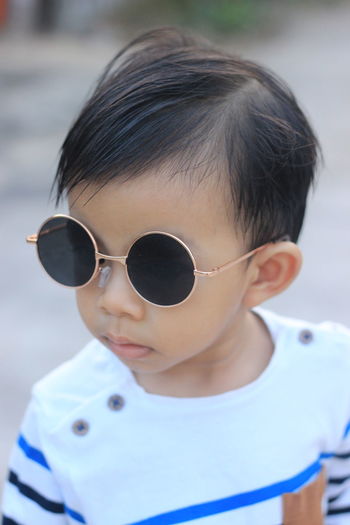 Portrait of cute boy wearing sunglasses