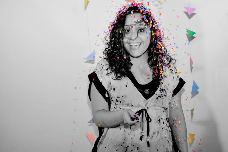 Portrait of woman covered in confetti