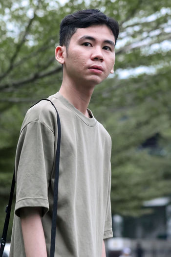 Portrait of young man standing outdoors