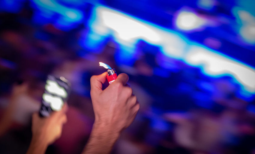 Cropped hand of woman holding electronic cigarette