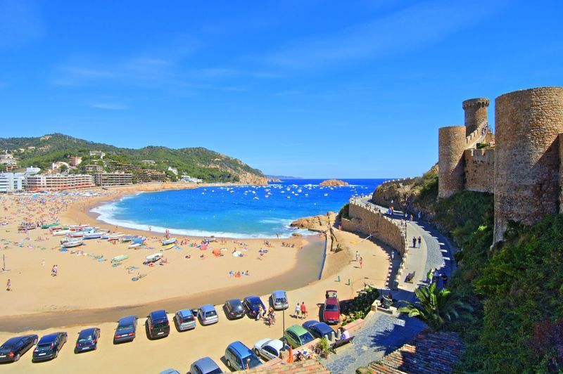 High angle view of castle by beach at tossa de mar