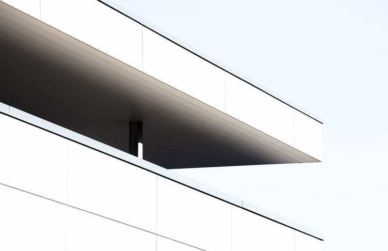 Low angle view of building corner against sky