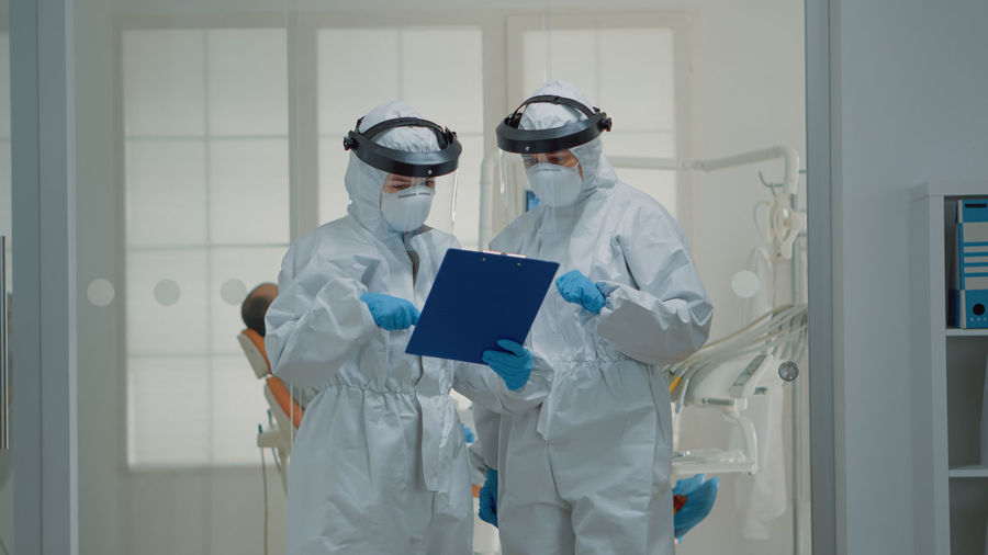 Digital composite image of female doctor standing in laboratory